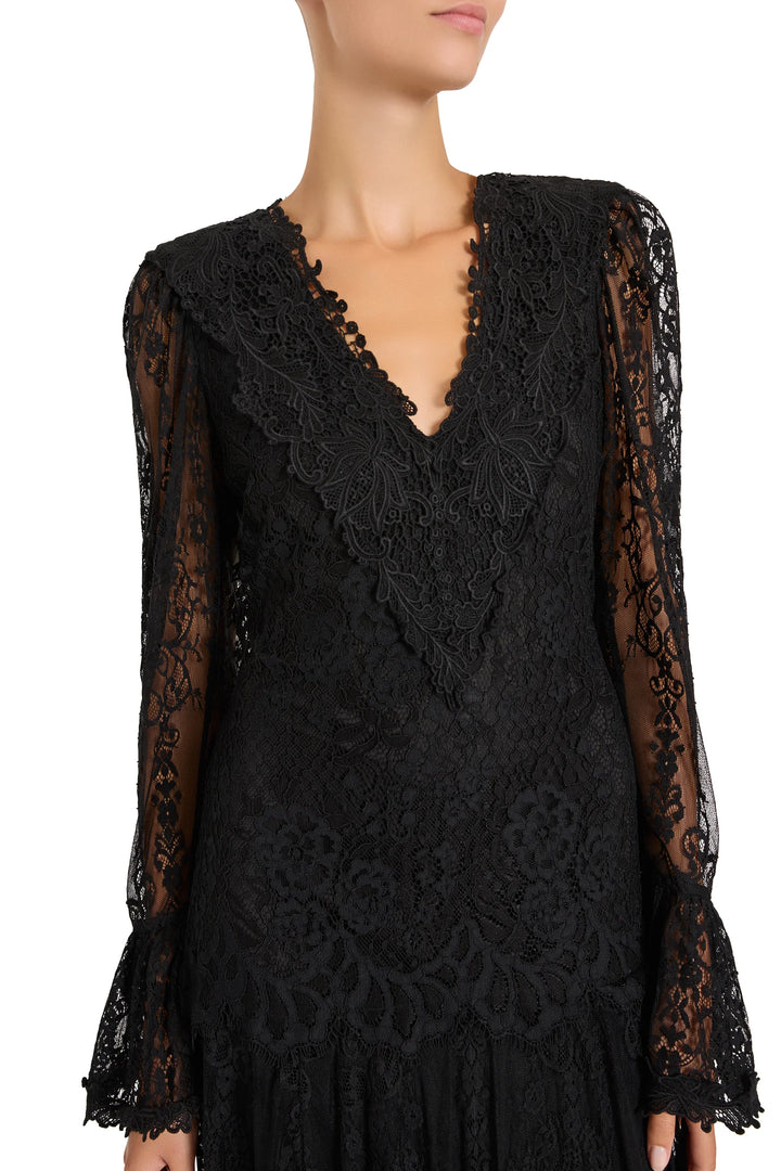 Tori midi lace dress with long sheer sleeves and embroidered V-neckline, front view on model.