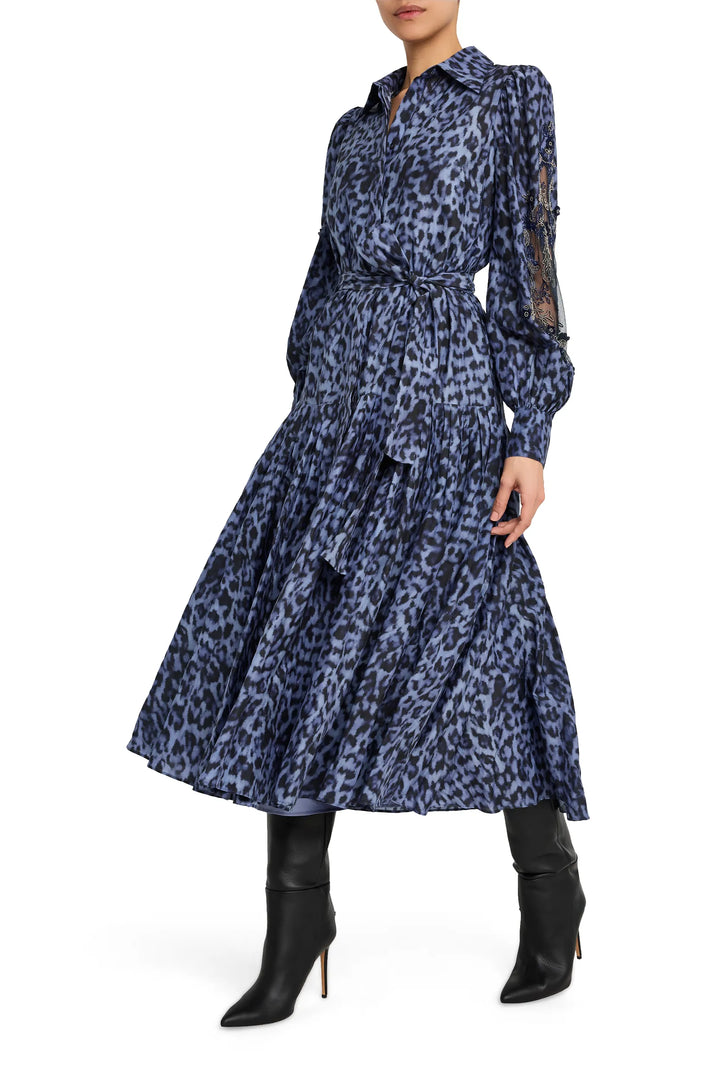 Midi dress with removable belt, fluid silhouette, subtle pleats, and printed crepe fabric; front view on model.