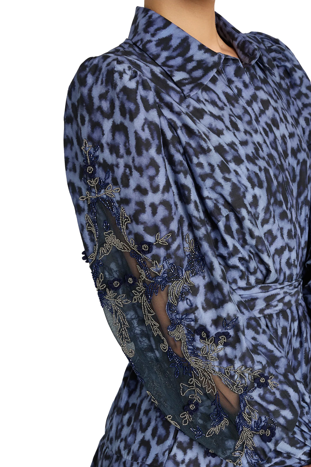 Animal print midi dress with sheer embroidered bishop sleeves, collared neckline; front view on model.