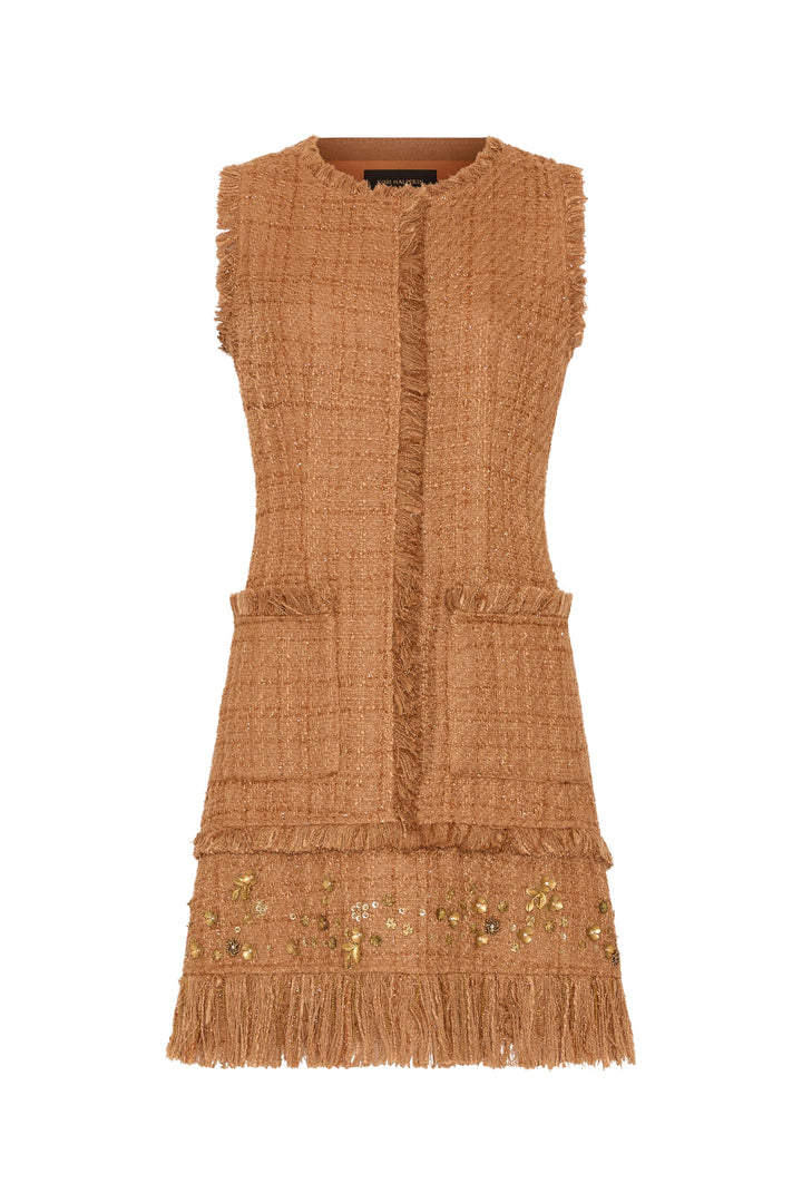 Sleeveless brown tweed dress, fringe trim, front pockets, gold accents, artisanal finish; front view on white.