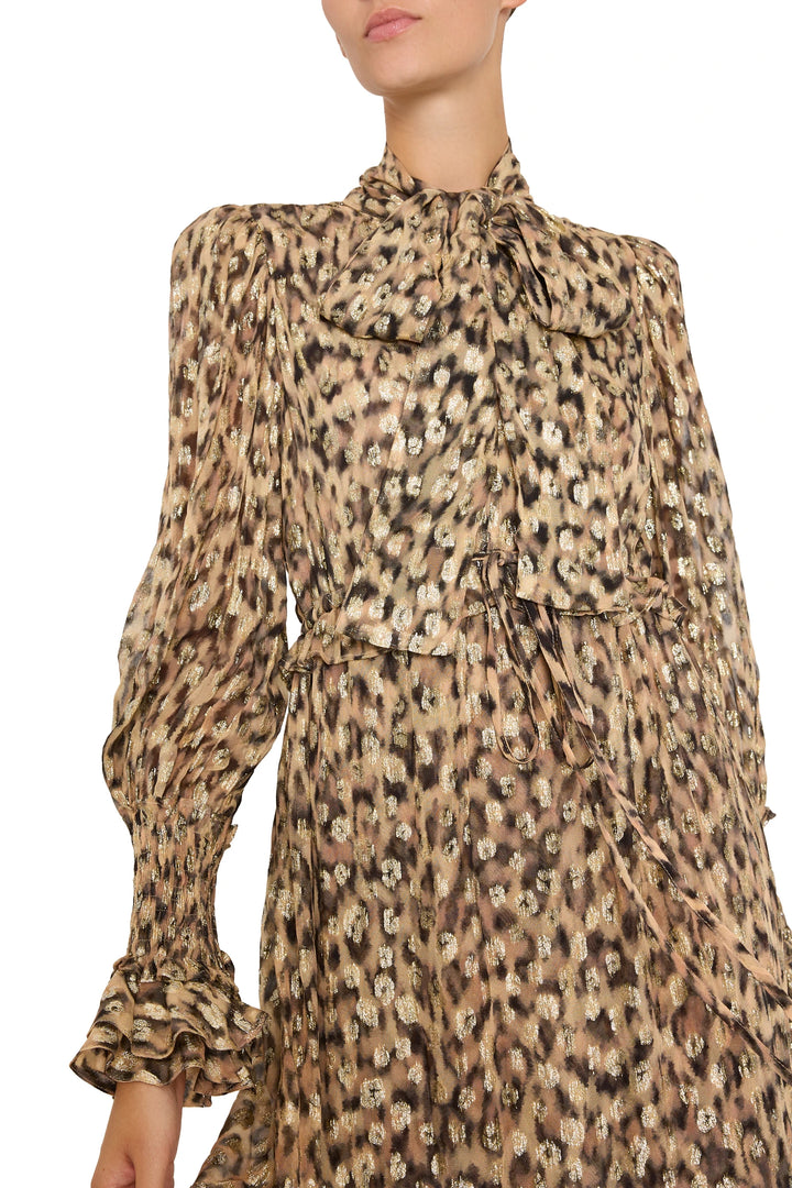 Midi dress with metallic leopard jacquard, bow neck, smocked cuffs; fluid silhouette; front view on model.
