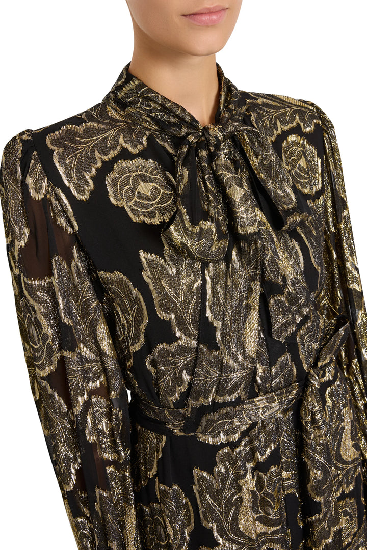 Rian Lurex Jacquard long-sleeved metallic floral tiered maxi dress with a pussy-bow neckline, front view on white.