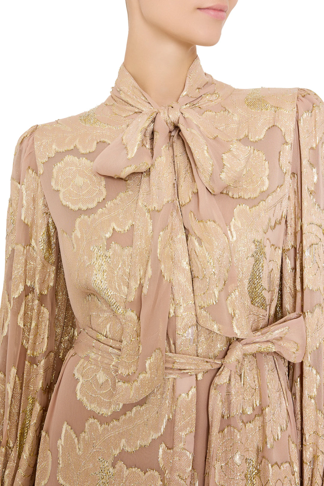 Rian Lurex Jacquard Long Dress, a metallic floral maxi with pussy-bow neckline and waist tie, front view on model.