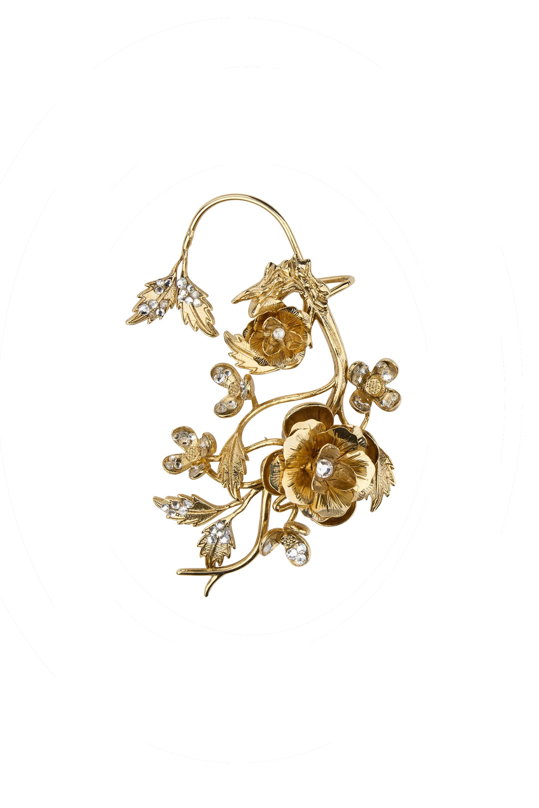 Ear cuff with sculpted floral silhouette, hand-set gemstones, polished metal; front view on white.