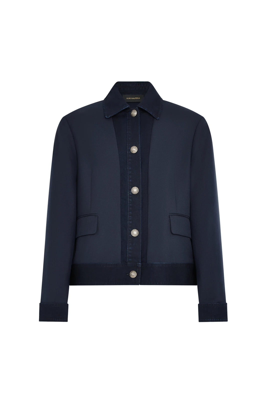 Structured denim jacket with collar, front flap pockets, and silver buttons. Twill fabric. Front view on white.