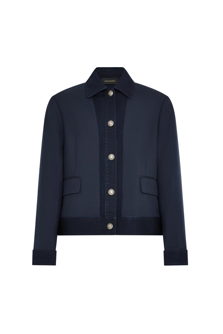 Structured denim jacket with collar, front flap pockets, and silver buttons. Twill fabric. Front view on white.