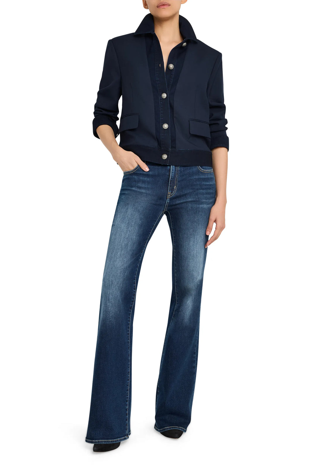 Cropped jacket with structured silhouette, tailored seams, denim and twill panels; front view on model.