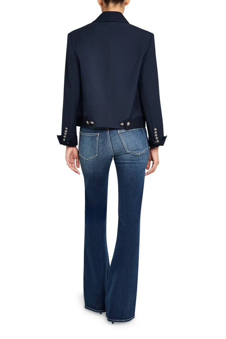 Structured twill denim combo jacket with classic collar, paneled construction, sharp hem; back view on white.