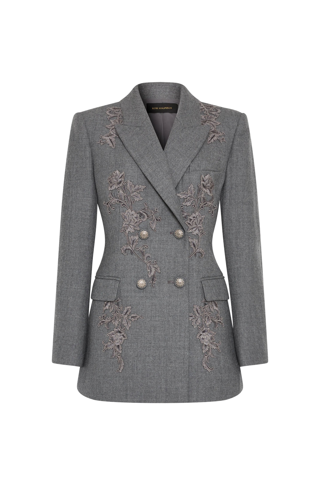 Double-breasted flannel blazer with floral front embroidery, structured silhouette. Front view on white.