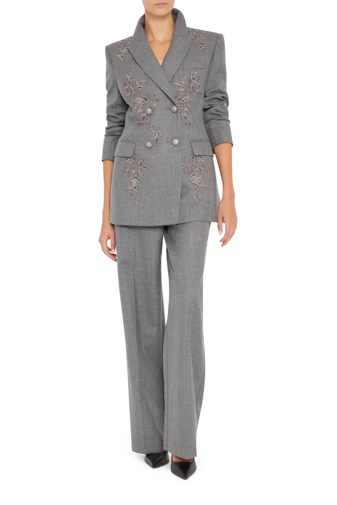 Double-breasted flannel blazer with hand-embroidered floral details, tailored silhouette. Front view on white.