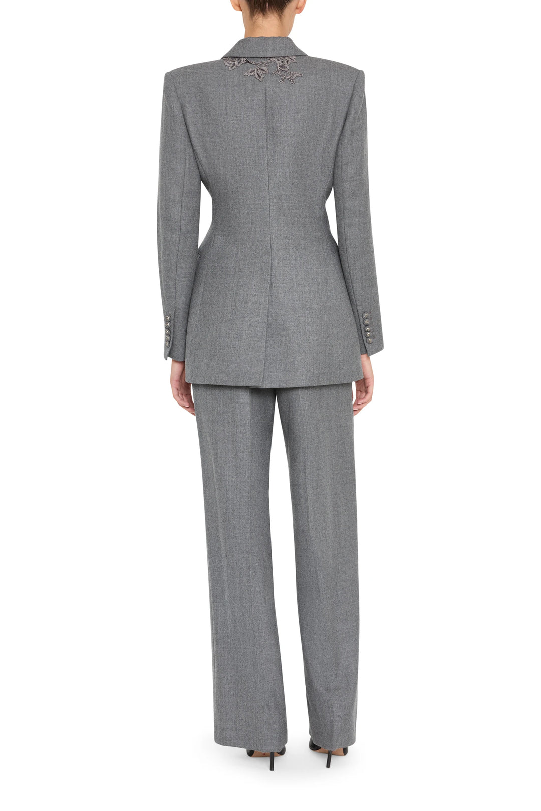 Single-breasted flannel blazer with detailed embroidery, structured shoulders, back vent; back view on model.