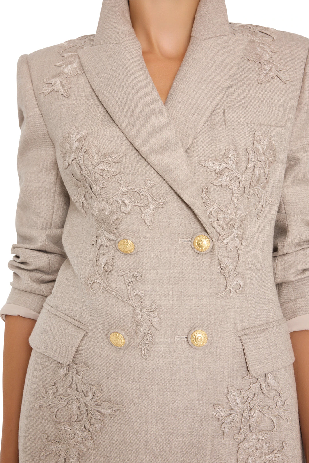 Embroidered flannel blazer with gold buttons, rolled sleeves, tailored silhouette; front view on model.