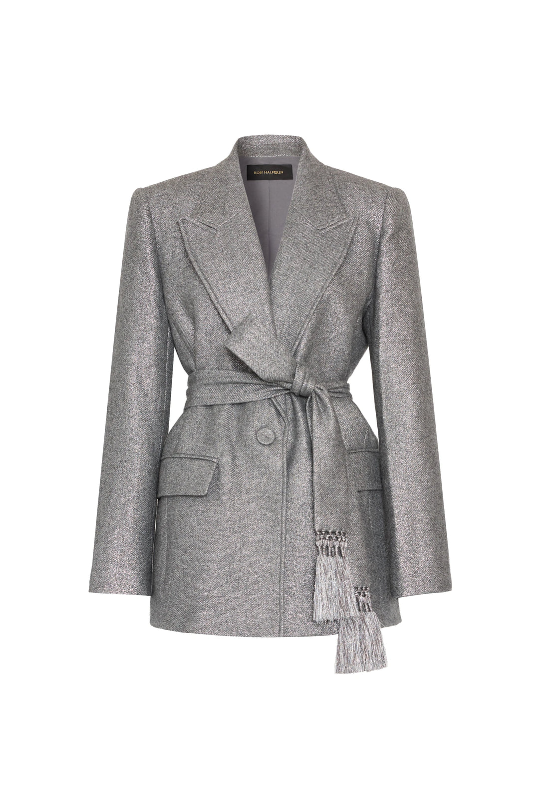 Silver lurex jacket with notched lapels, removable belt, tassels, flap pockets; tailored fit. Front view on white.