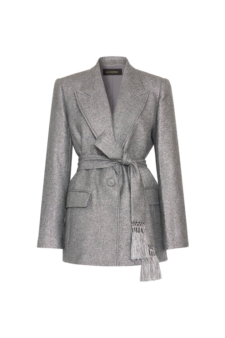Silver lurex jacket with notched lapels, removable belt, tassels, flap pockets; tailored fit. Front view on white.