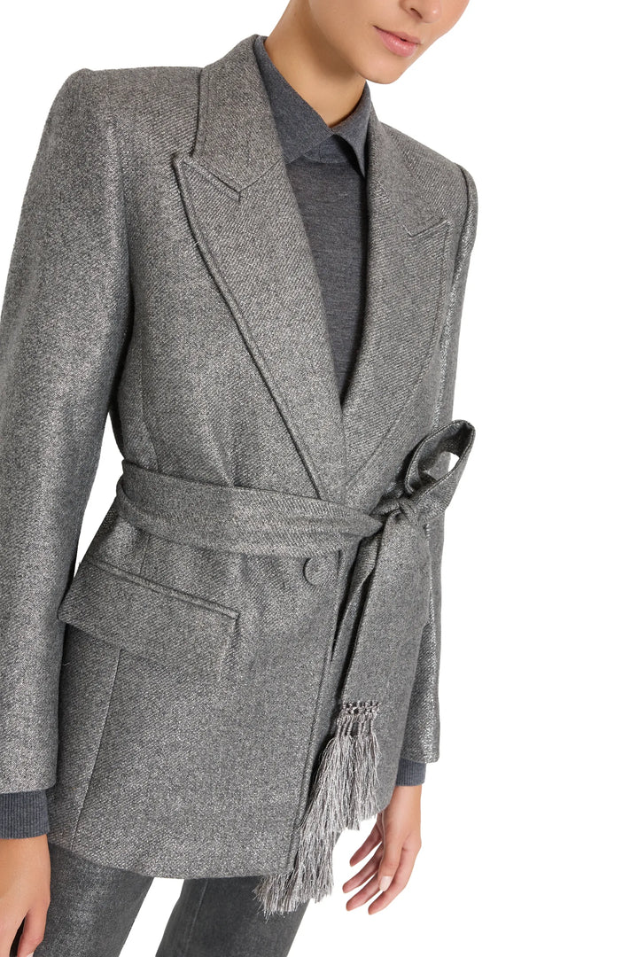 Metallic wool jacket with structured shoulders, mid-thigh length, classic collar, front view on model.