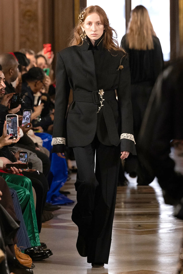 Jillian Jeweled Belted Blazer in black tropical wool with cinched waist, jeweled buckle, and lace cuffs, front view model.