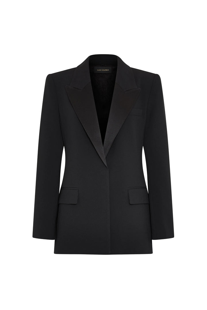Tailored crepe blazer with satin lapels, structured shoulders, two flap pockets. Front view on white.