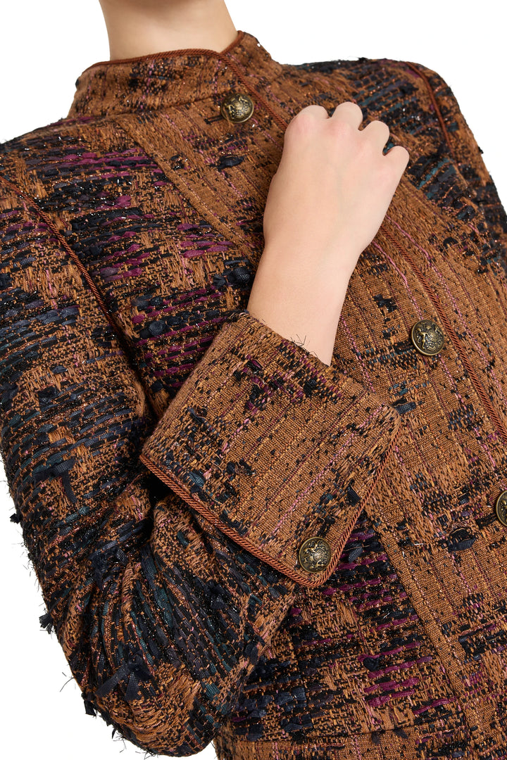 Detail of Parker Tweed Jacket with metallic buttons, structured collar and textured tweed fabric; detail view.
