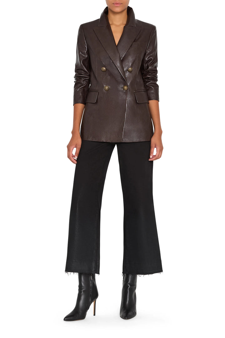 Double-breasted vegan leather blazer with notched lapel and structured silhouette, front view on model.