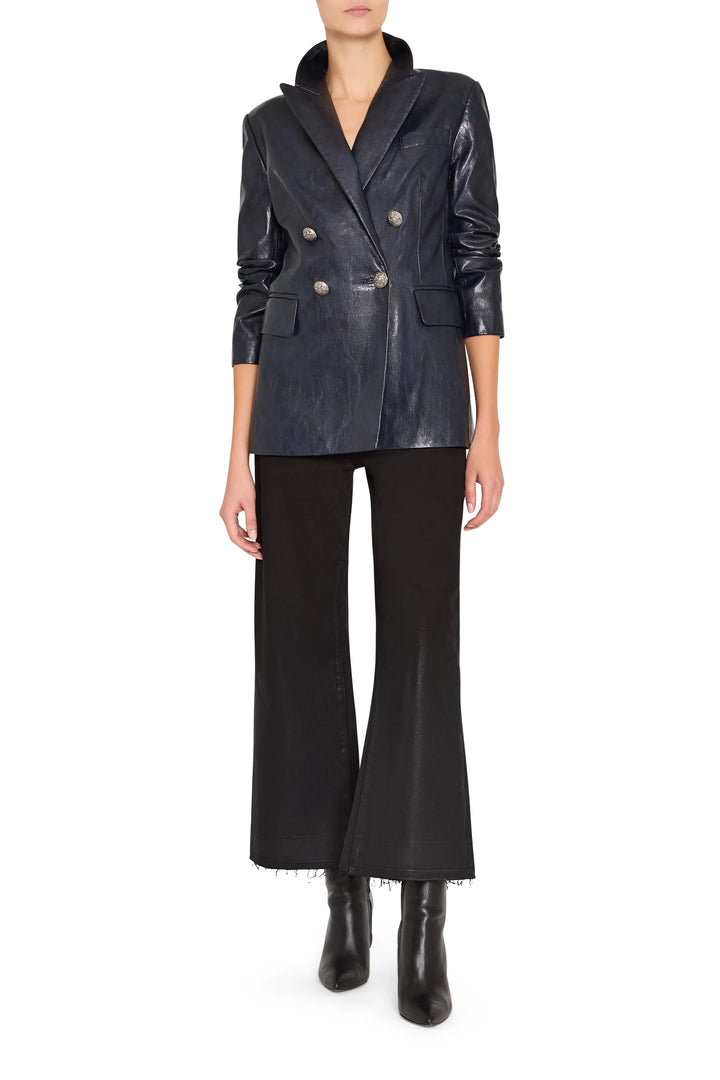 Double-breasted vegan leather blazer with structured shoulders and notched lapel, front view on model.