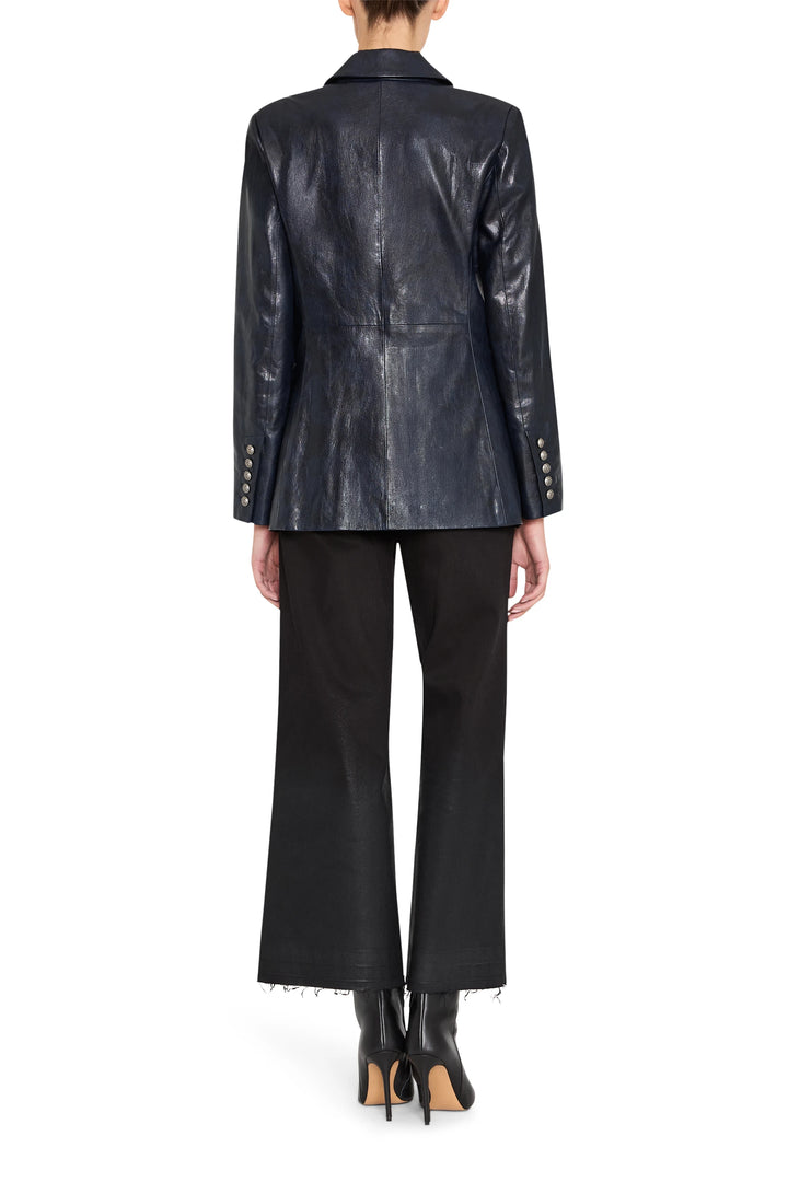 Tailored double-breasted vegan leather blazer with structured shoulders, back view on model.