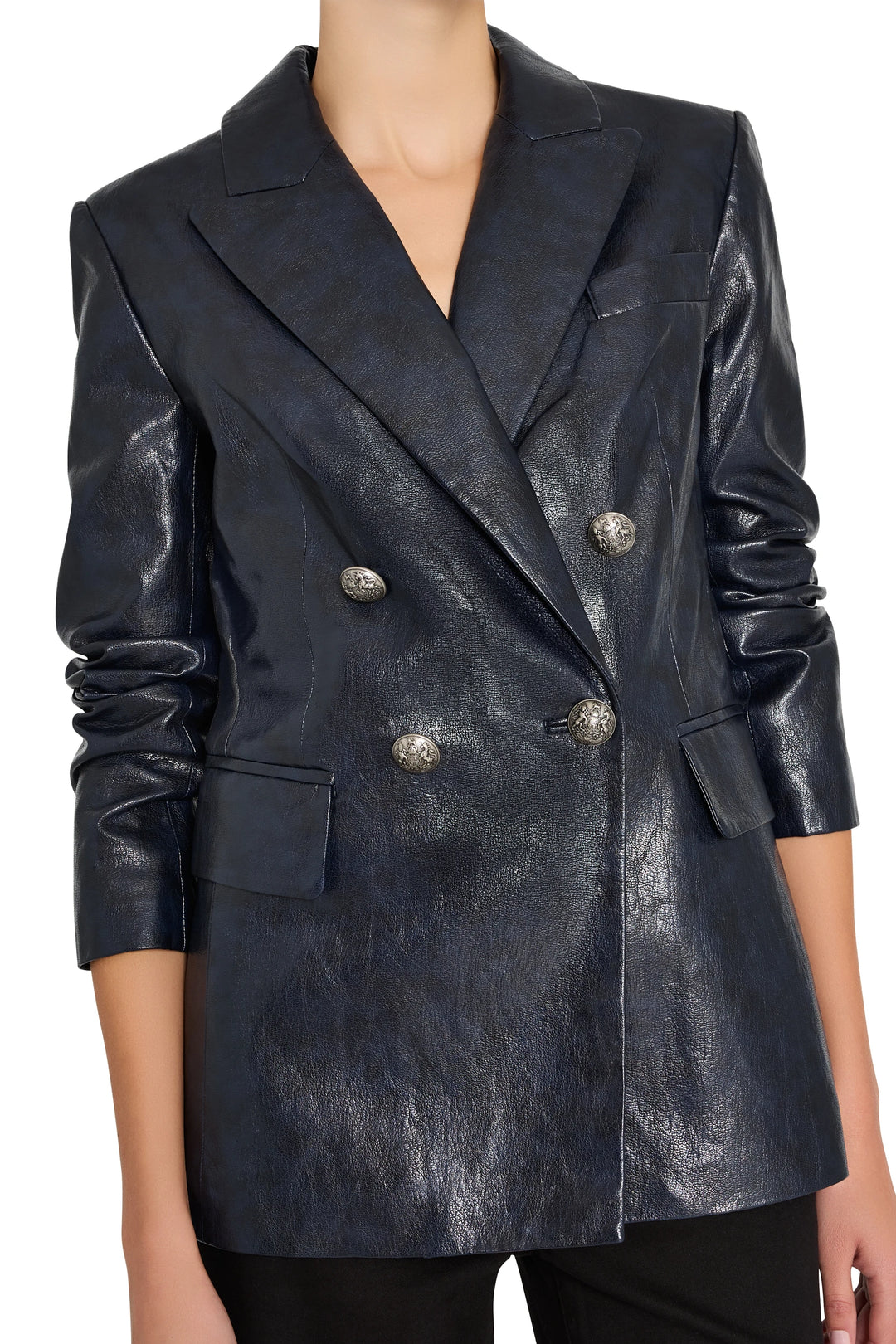 Double breasted vegan leather blazer, structured silhouette, silver buttons. Front view on model.