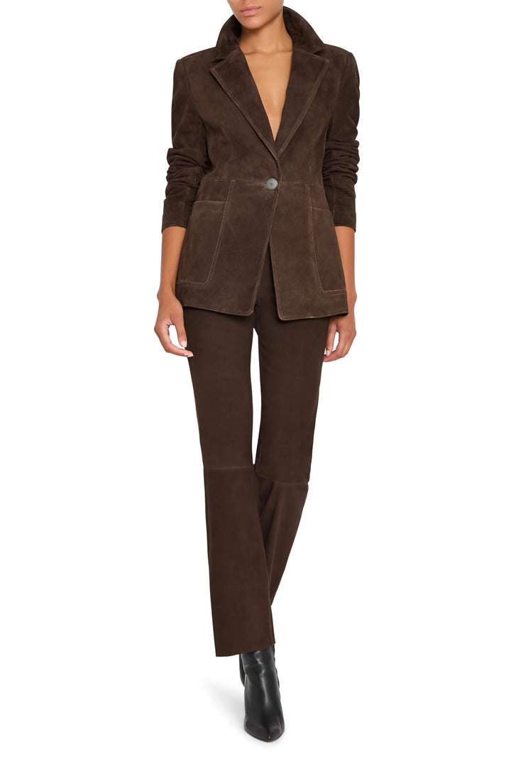 Tailored suede blazer with classic lapel, single-breasted front, structured silhouette; front view on white.