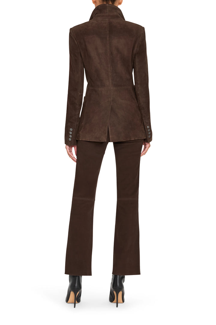 Elongated silhouette blazer in suede with classic lapels and tailored seams, back view on model.