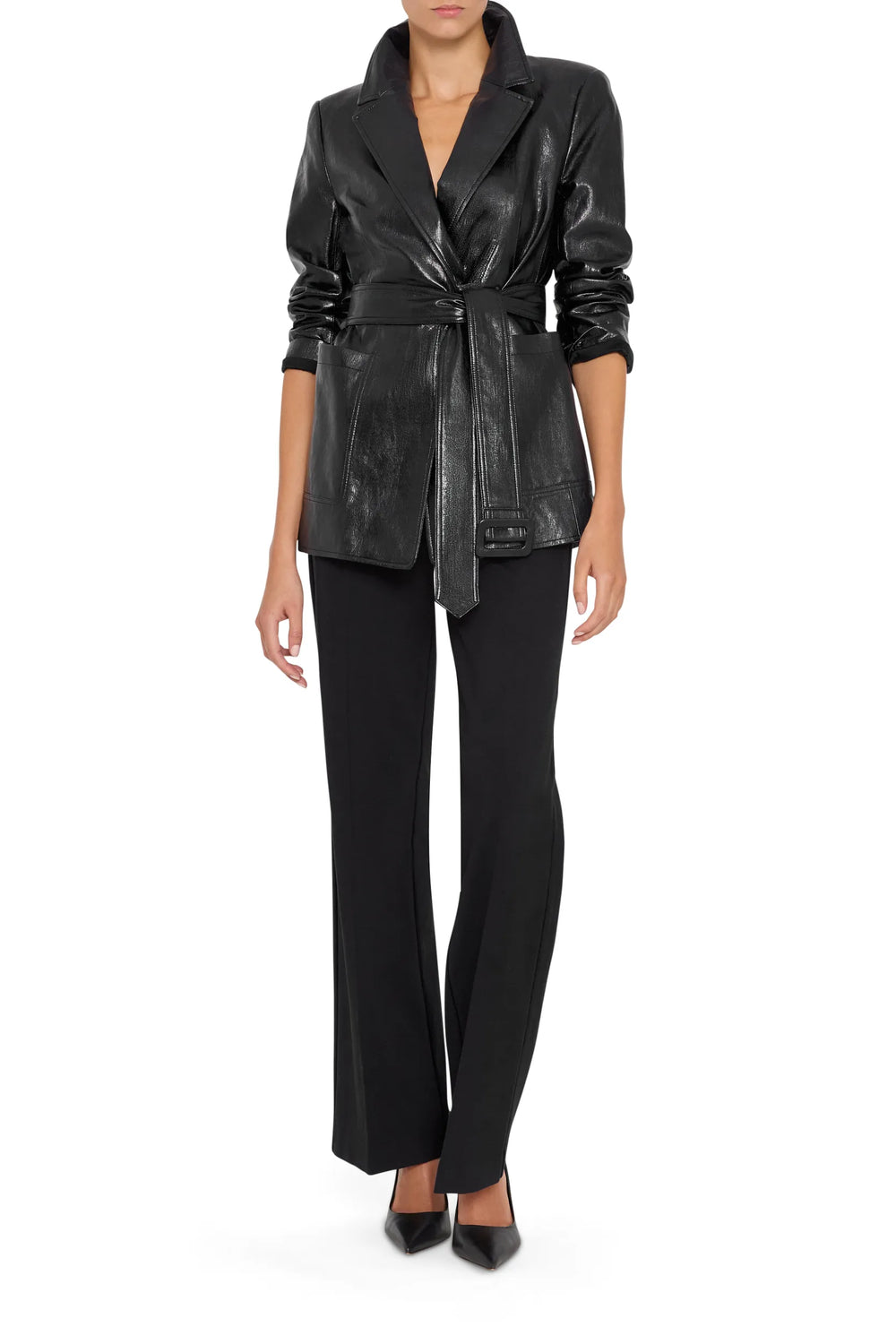 Fitted vegan leather jacket with notched lapels, zip front, and structured shoulders; front view on model.
