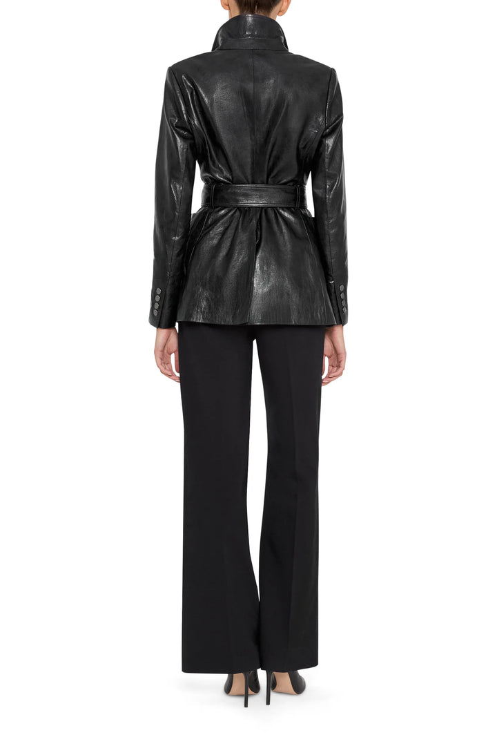 Straight-cut vegan leather jacket with structured shoulders and clean seams, back view on model.