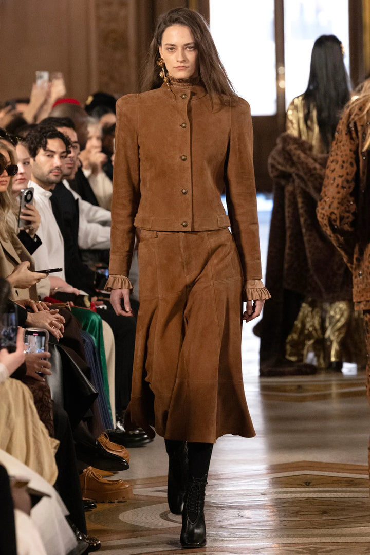 Suede jacket with tailored silhouette and structured seams, front view on model.