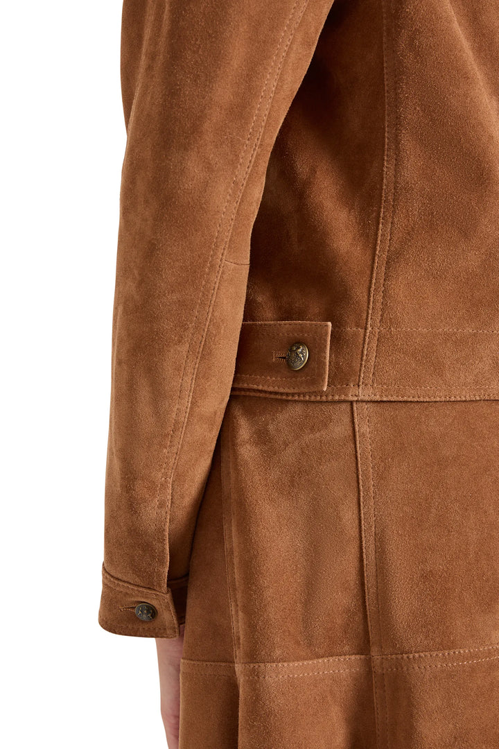 Suede jacket with metal buttons at sleeve cuff and waist tab, detailed construction. Detail view.