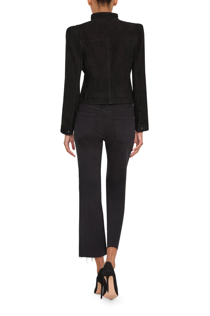 Suede jacket with structured silhouette, classic collar, and seam detailing; back view on model.