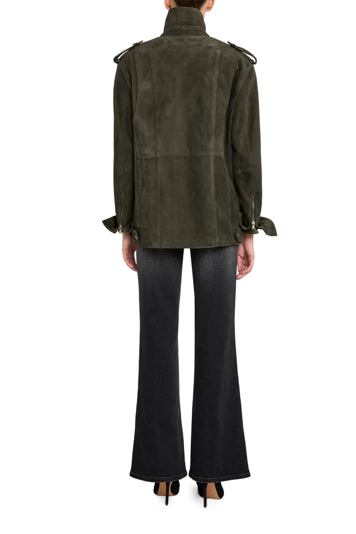 Suede moto jacket with sharp tailoring, notch collar, zip details; hip length. Back view on model.