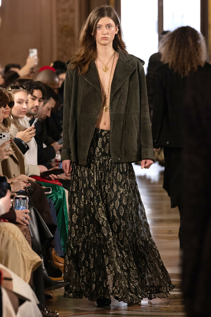 Shona Long Lurex Skirt with fluid silhouette and metallic fabric, midi length; front view on model.