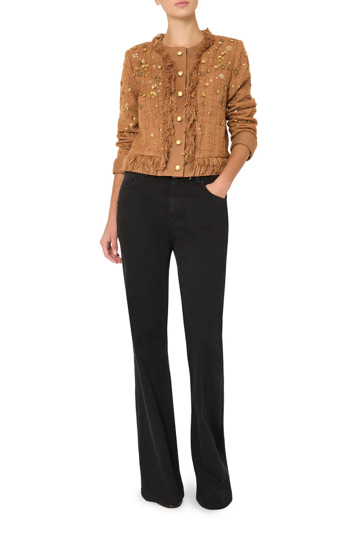 Single-breasted tweed jacket with structured shoulders, gold buttons, front pockets; front view on model.