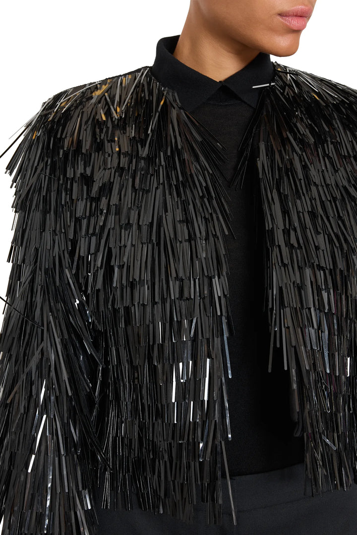 Structured jacket with couture embellishment, shiny sequin fringe at shoulders and chest; front view on model.