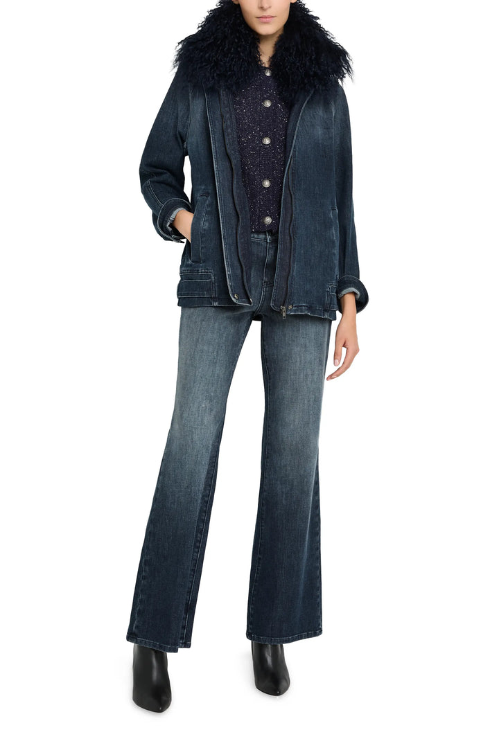 Relaxed-fit denim jacket with shearling collar, button front, chest flap pockets; front view on model.