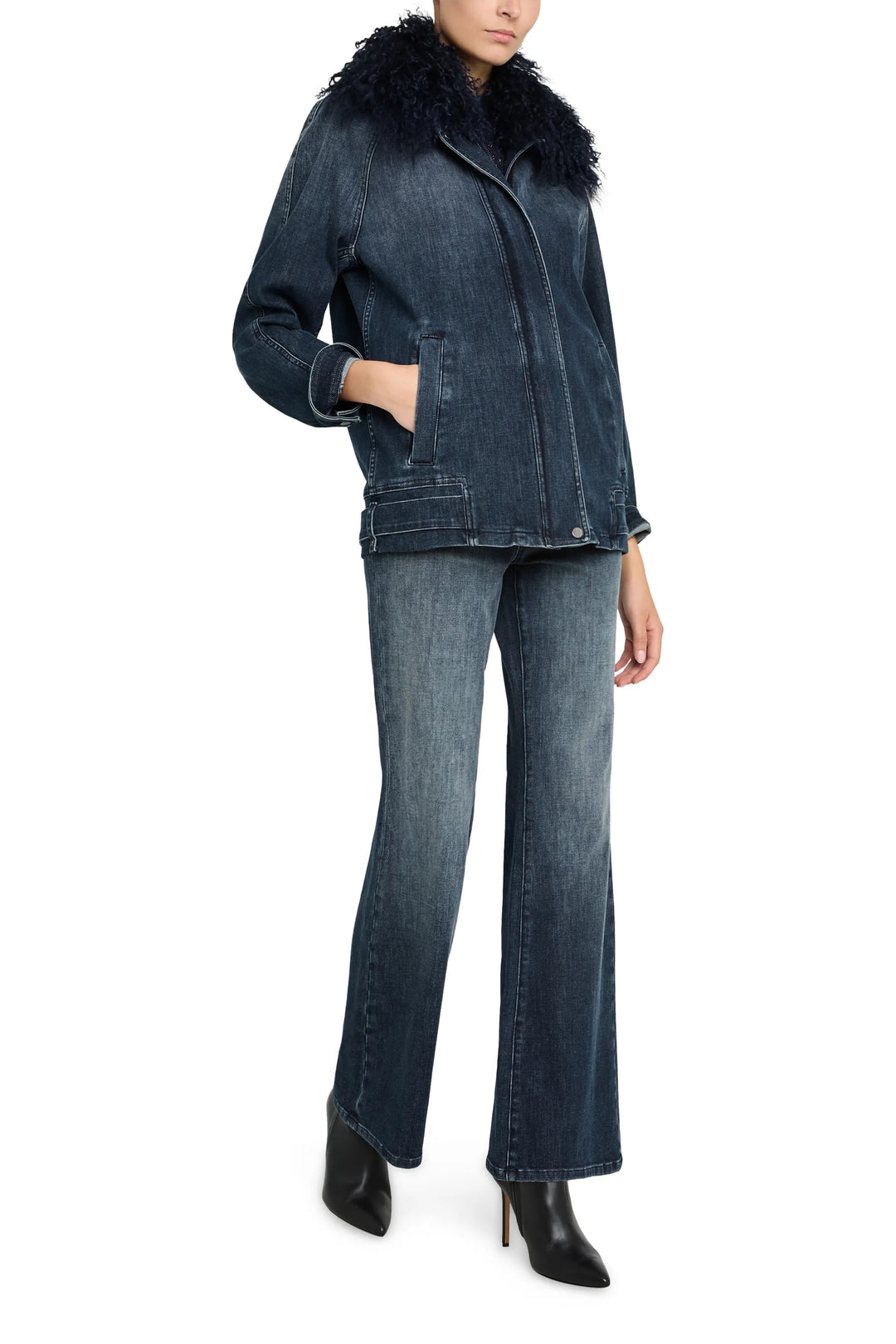 Relaxed-fit denim jacket with shearling collar, paneled construction, front button closure. Front view on model.