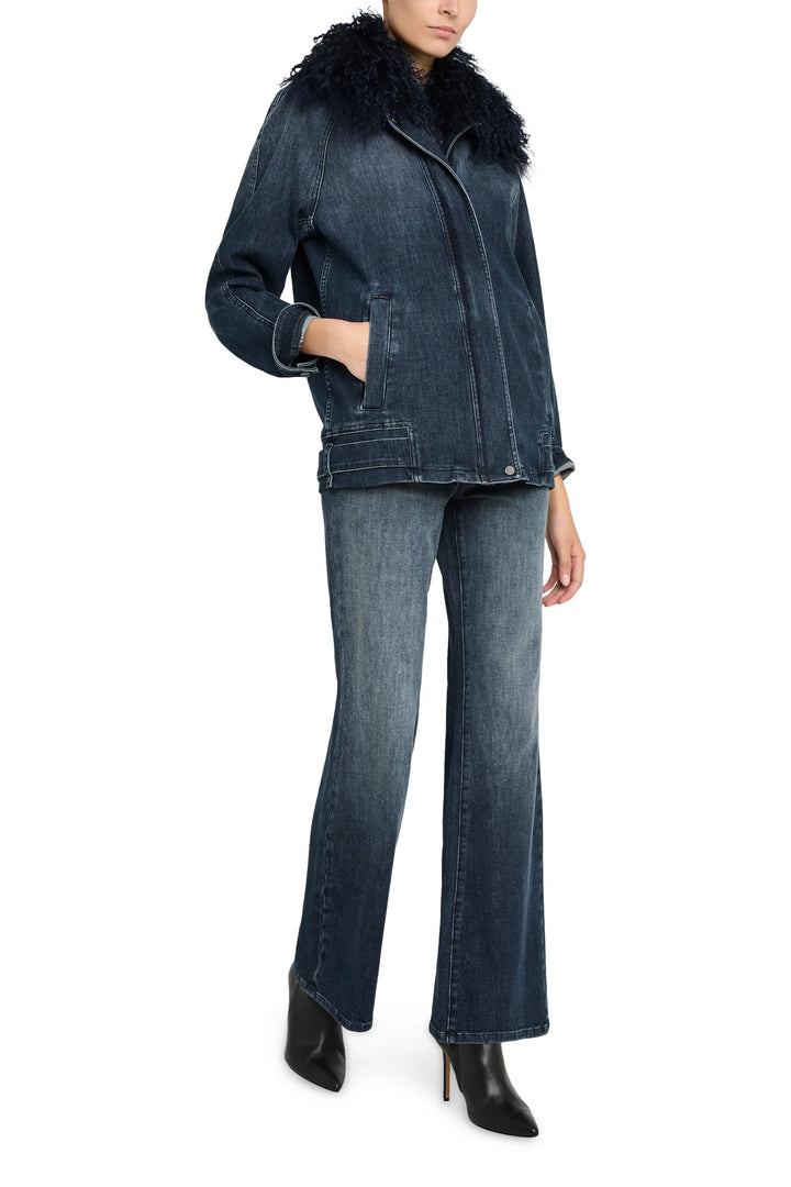 Relaxed-fit denim jacket with shearling collar, paneled construction, front button closure. Front view on model.