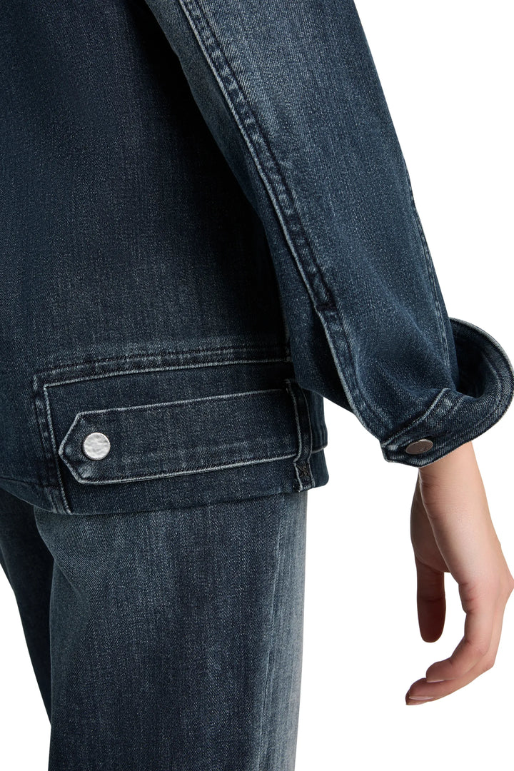Denim jacket with relaxed fit, shearling collar, classic pockets and button front; front view on model.