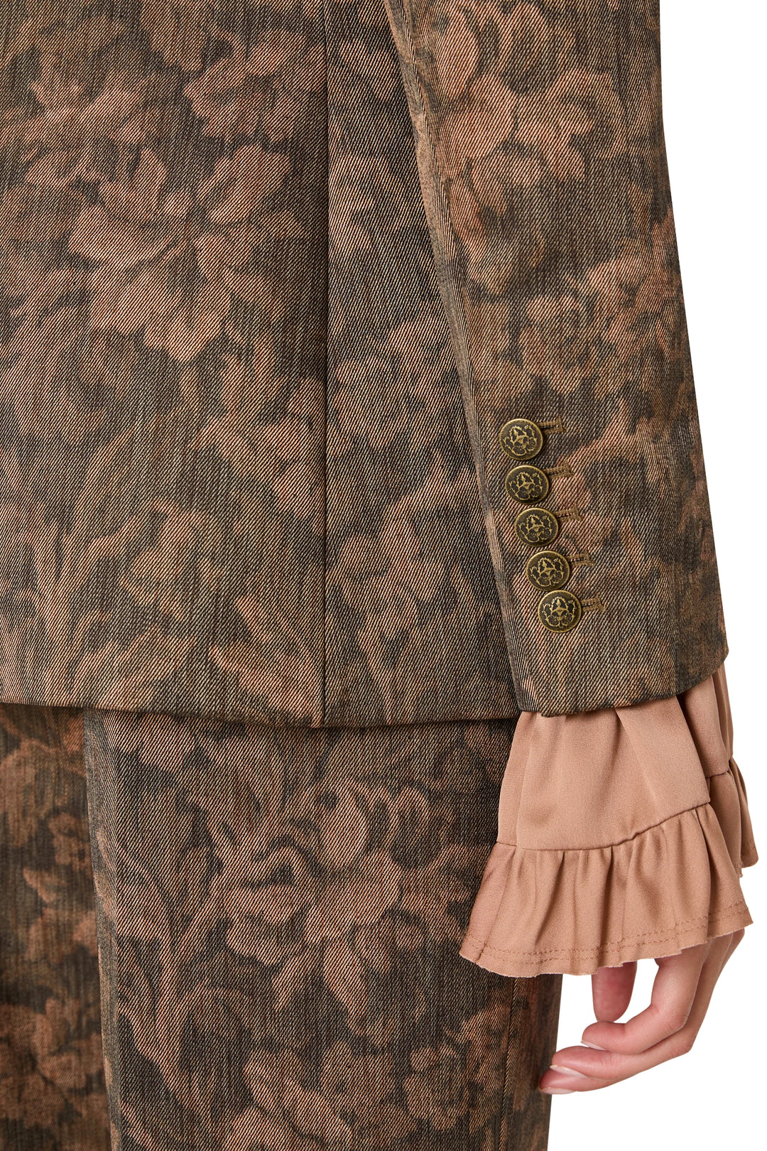 Lisa Jacquard blazer sleeve featuring five gold-tone crest buttons at the cuff, detail view.