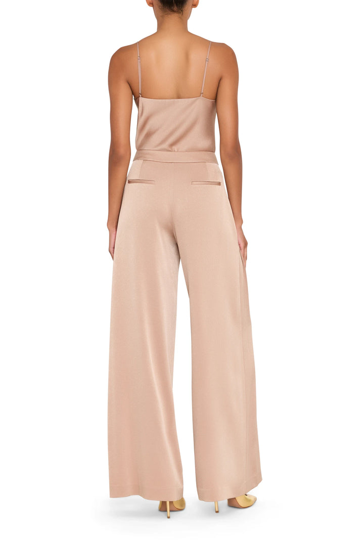 Wide-leg crepe pant with fluid silhouette and smooth finish. Back view on model.
