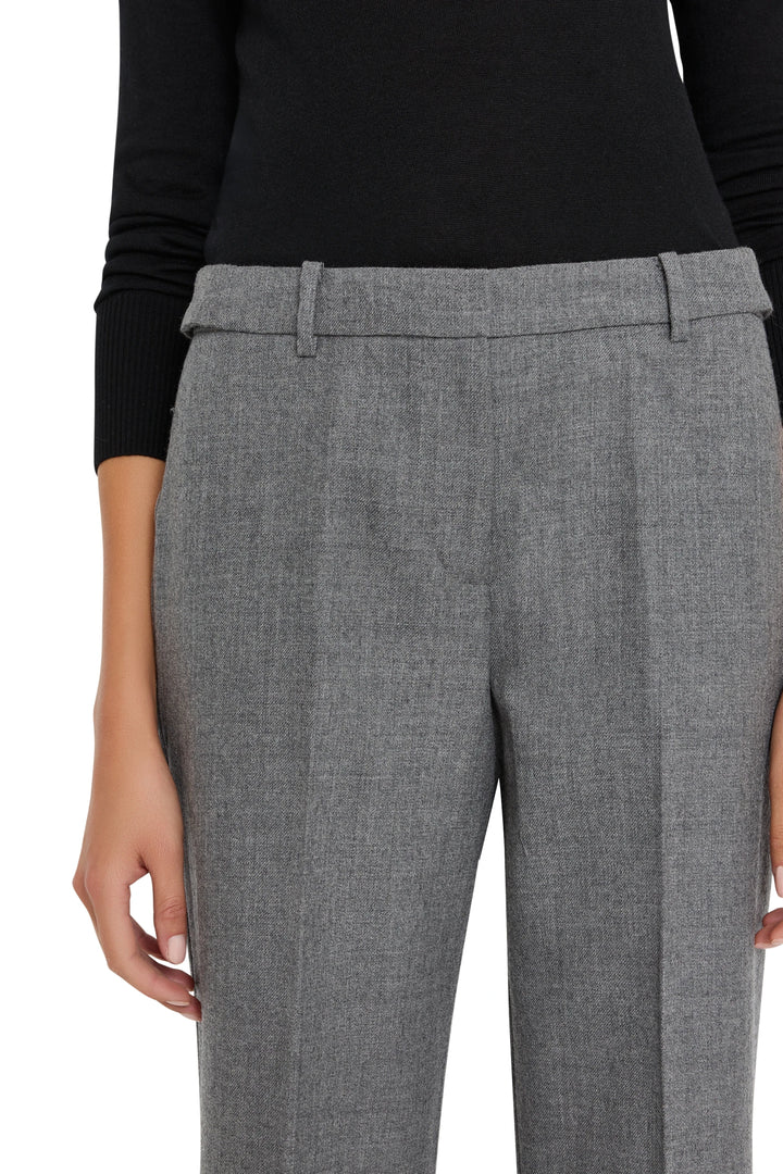 Wide-leg gray flannel pant with wide cuff, tailored construction. Front view on model.