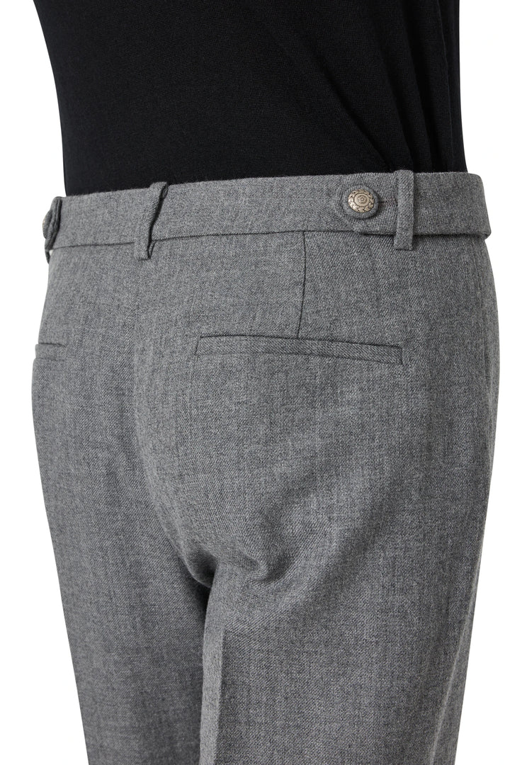 Wide-leg flannel pant with wide cuffs, side and back pockets; structured silhouette. Side view on model.