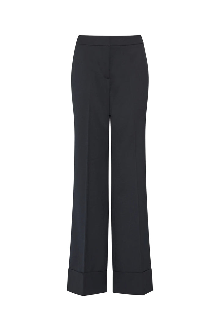 Kenny Twill Pant: wide-leg tropical wool trousers with front creases and cuffed hems, front view on white.