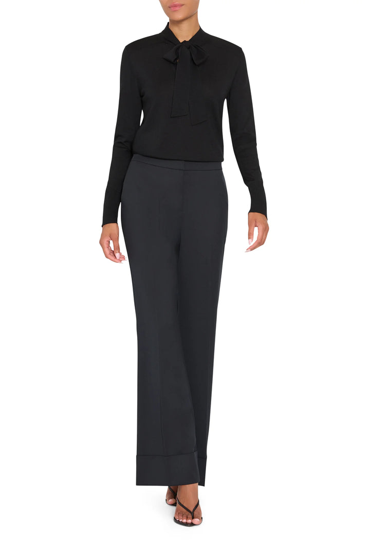 Kenny Twill Pant in black tropical wool with a cuffed hem, front view on model.