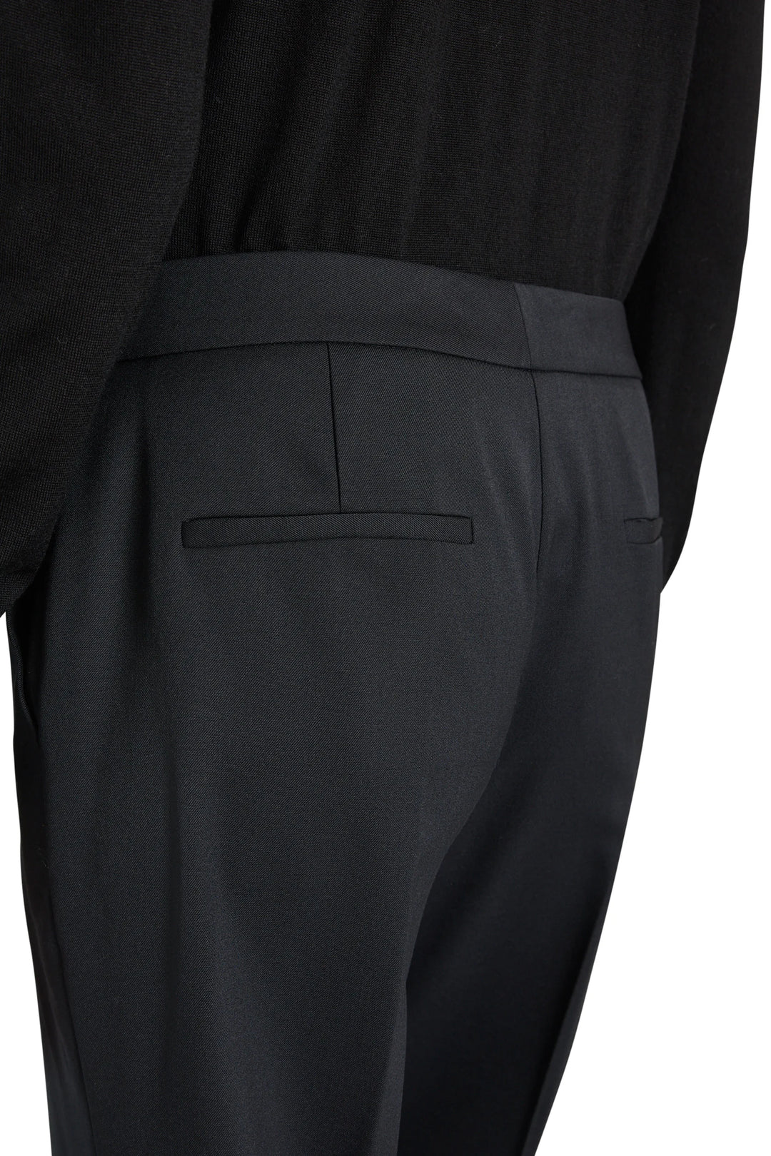 Kenny Twill Pant tropical wool tailored trousers with a back welt pocket and darted waistband, back view.