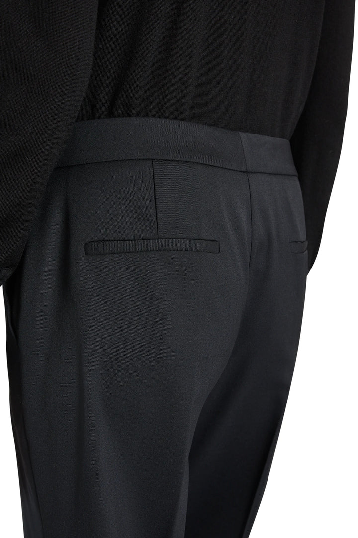 Kenny Twill Pant tropical wool tailored trousers with a back welt pocket and darted waistband, back view.