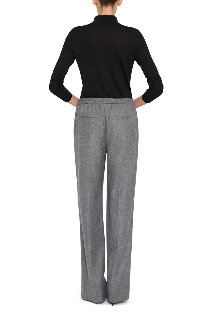 Wide-leg flannel pant with elastic waistband, clean hem, soft texture. Back view on model.